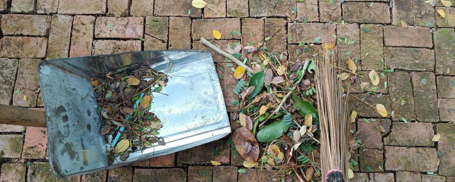 sweeping-dry-leaves-with-broom-garden-maintenance-worker-in-park-garden-cleans-the-roads-free-photo